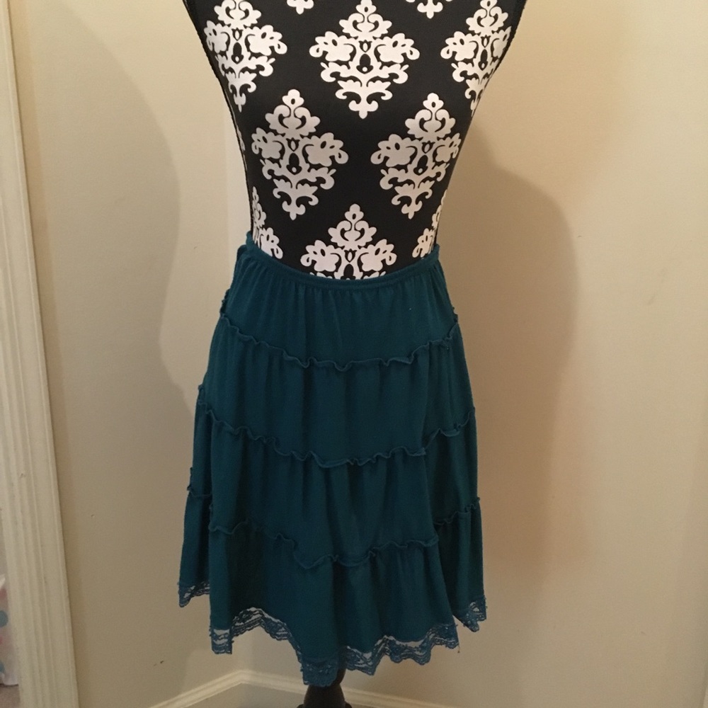 Medium, blue/green skirt